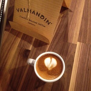 A latte art heart in a cup of delicious Valmandin gourmet coffee, freshly artisan roasted in Geneva.