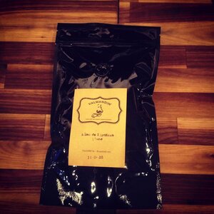 A bag of freshly roasted Valmandin L'âme de l'artisan coffee.