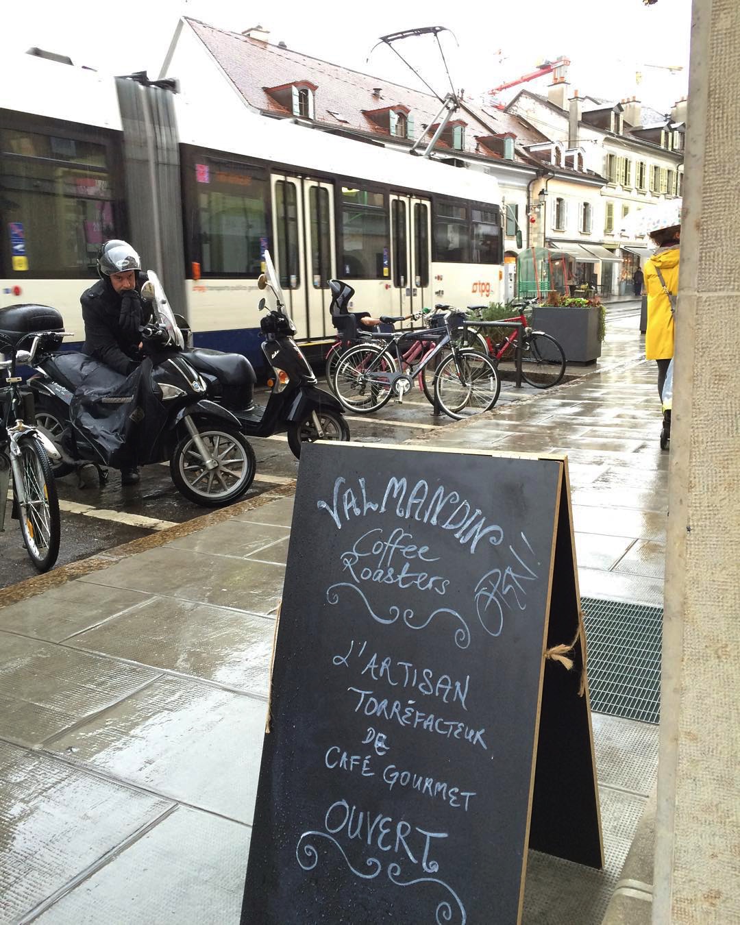 The Valmandin signage out on a rainy street. The perfect moment for a warm cup of freshly roasted and brewed Valmandin gourmet coffee.