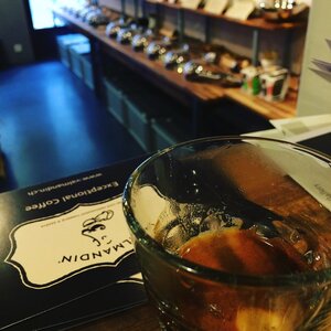 A delicious cup of exceptional coffee from Valmandin in front of the Valmandin coffee shop in Carouge.