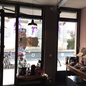 Sunny and festive Valmandin coffee roaster's shop window.